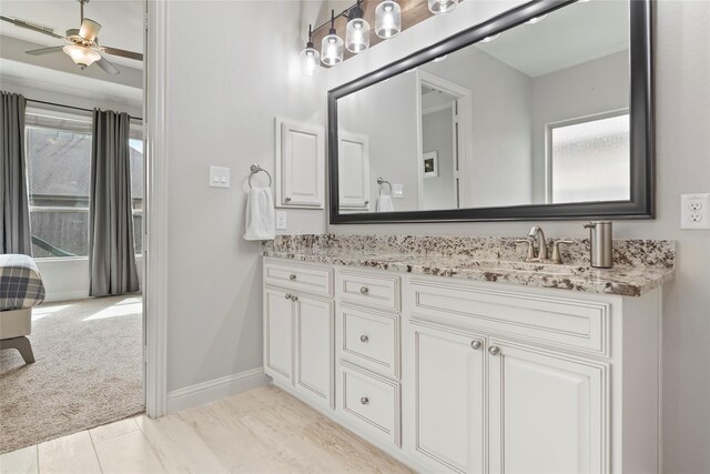 2023 Aspen Point Ln, Richmond, TX 77469 - bathroom featuring double vanity, a ceiling fan, and baseboards