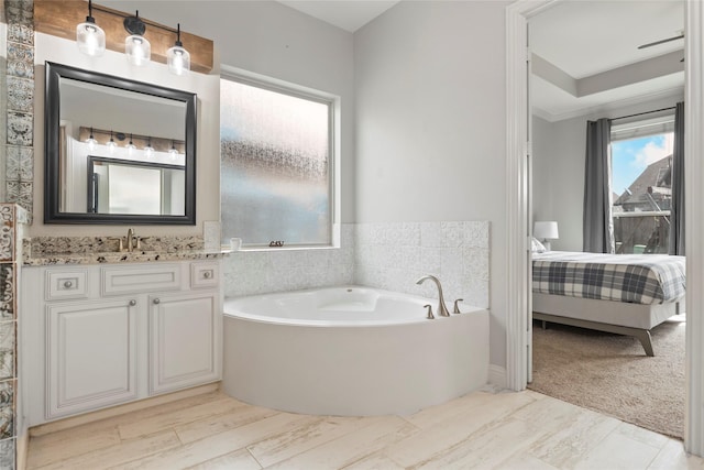 2023 Aspen Point Ln, Richmond, TX 77469 - bathroom featuring connected bathroom, a bath, and vanity