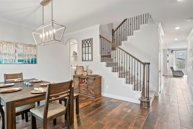 2023 Aspen Point Ln, Richmond, TX 77469 - dining room featuring wood finished floors, ornamental molding, arched walkways, stairs, and baseboards