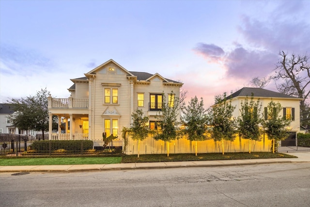 300 E 26th St, Houston, TX 77008 - view of front of house with a balcony and a fenced front yard
