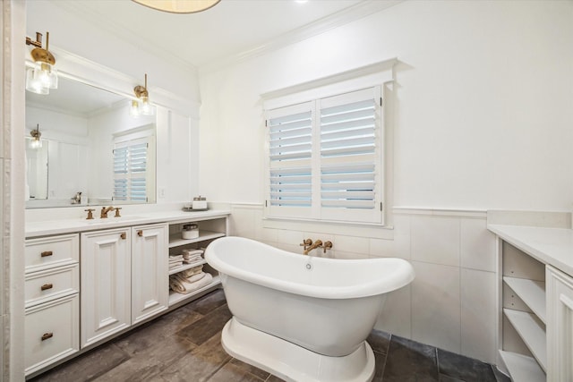 300 E 26th St, Houston, TX 77008 - bathroom with vanity, a freestanding bath, crown molding, a wainscoted wall, and ceiling fan