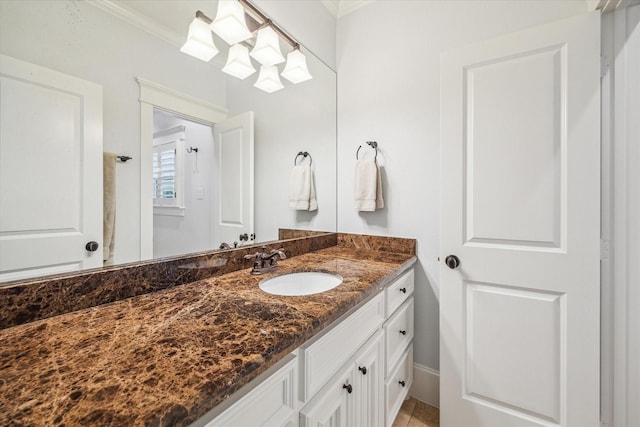 300 E 26th St, Houston, TX 77008 - bathroom with crown molding and vanity