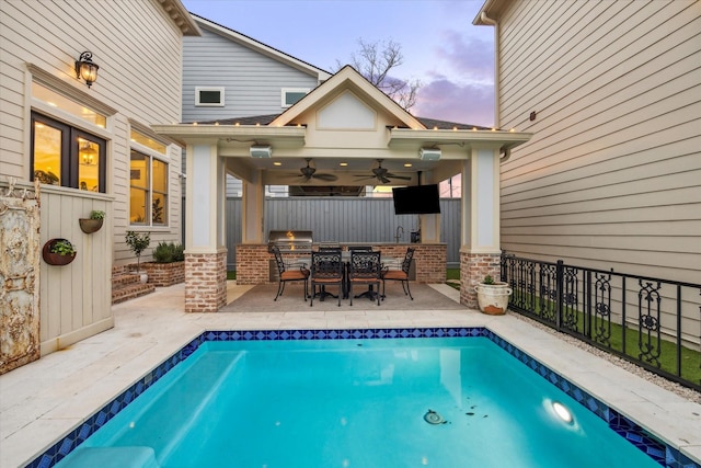 300 E 26th St, Houston, TX 77008 - view of swimming pool with an outdoor kitchen, a ceiling fan, fence, a patio, and grilling area