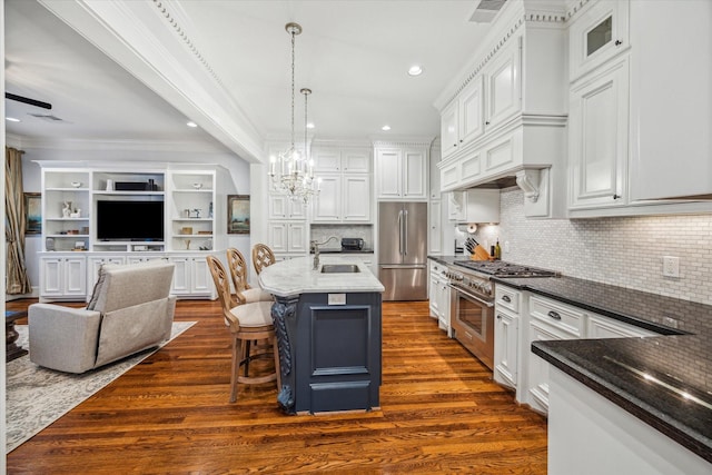 300 E 26th St, Houston, TX 77008 - kitchen featuring premium appliances, a sink, open floor plan, white cabinetry, and dark wood finished floors
