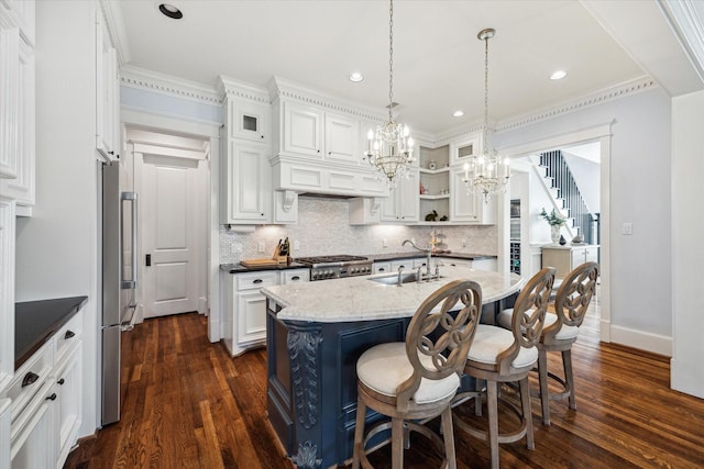300 E 26th St, Houston, TX 77008 - kitchen with a chandelier, white cabinets, dark wood-style floors, recessed lighting, and crown molding