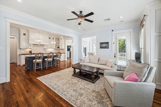 300 E 26th St, Houston, TX 77008 - living room featuring ceiling fan, dark wood finished floors, crown molding, recessed lighting, and a chandelier