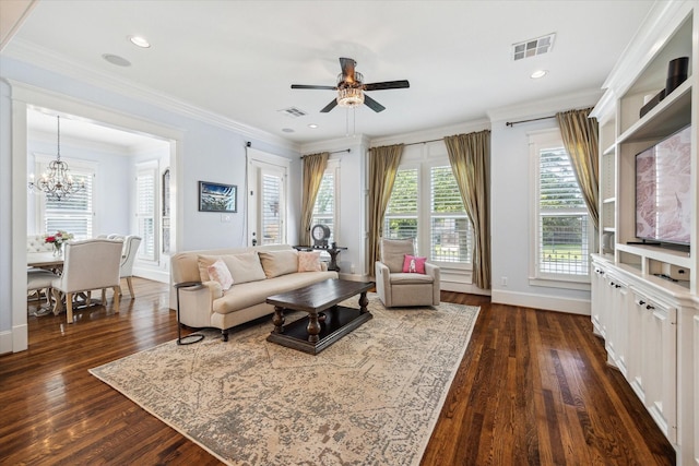 300 E 26th St, Houston, TX 77008 - living area featuring dark wood-type flooring, baseboards, ceiling fan, a chandelier, and ornamental molding