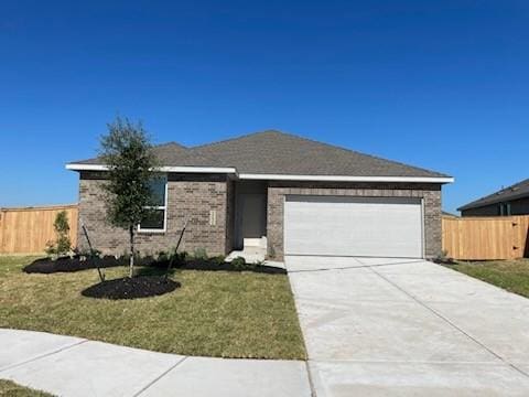 1202 Garrett Sudhendrio Dr, Crosby, TX 77532 - ranch-style home featuring a garage, driveway, and brick siding