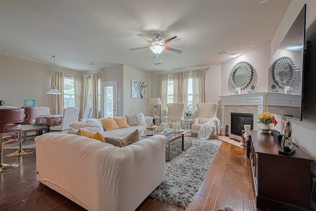 2812 Baywater Creek Ln, Pearland, TX 77089 - living area with a ceiling fan, dark wood-style flooring, and a fireplace