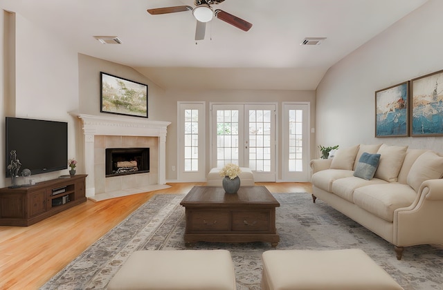 14418 Dunsmore Pl, Cypress, TX 77429 - living area with lofted ceiling, ceiling fan, wood finished floors, and a fireplace