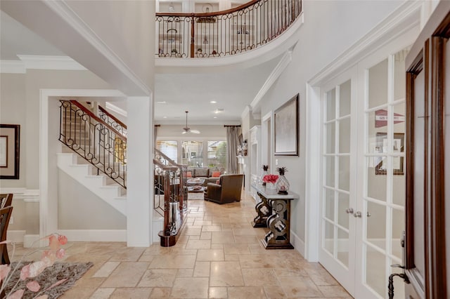 19 Royal Hampton Ct, Sugar Land, TX 77479 - entryway featuring french doors, ornamental molding, stairs, stone tile floors, and a towering ceiling