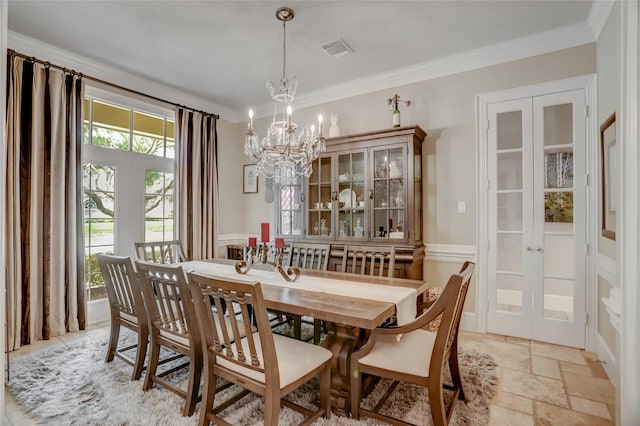 19 Royal Hampton Ct, Sugar Land, TX 77479 - dining room featuring a chandelier, french doors, stone tile flooring, and crown molding