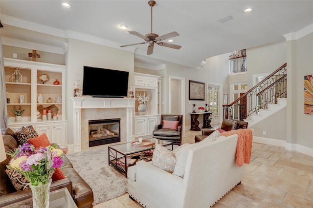 19 Royal Hampton Ct, Sugar Land, TX 77479 - living room featuring a tile fireplace, ornamental molding, ceiling fan, recessed lighting, and stairs