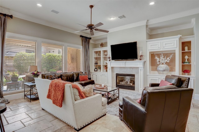 19 Royal Hampton Ct, Sugar Land, TX 77479 - living room featuring built in shelves, crown molding, a ceiling fan, recessed lighting, and a tile fireplace