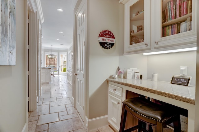 19 Royal Hampton Ct, Sugar Land, TX 77479 - bar featuring baseboards, stone tile floors, recessed lighting, and crown molding