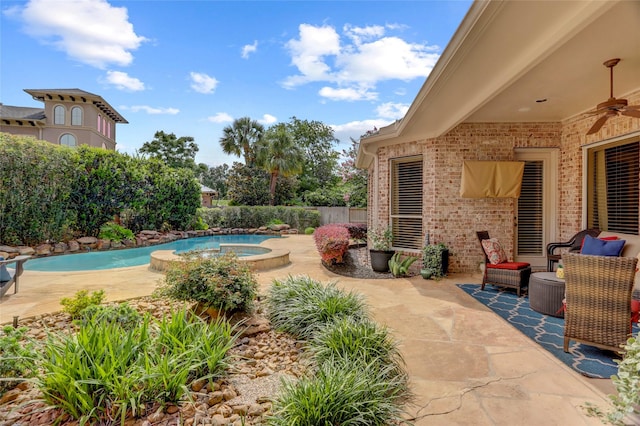 19 Royal Hampton Ct, Sugar Land, TX 77479 - view of swimming pool with an in-ground hot tub, a ceiling fan, a patio area, and a fenced backyard