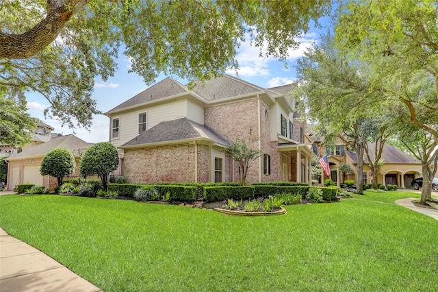 19 Royal Hampton Ct, Sugar Land, TX 77479 - view of front of property featuring brick siding, a front yard, roof with shingles, and an attached garage