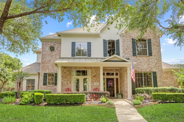 19 Royal Hampton Ct, Sugar Land, TX 77479 - view of front of home with brick siding, a front lawn, and a shingled roof