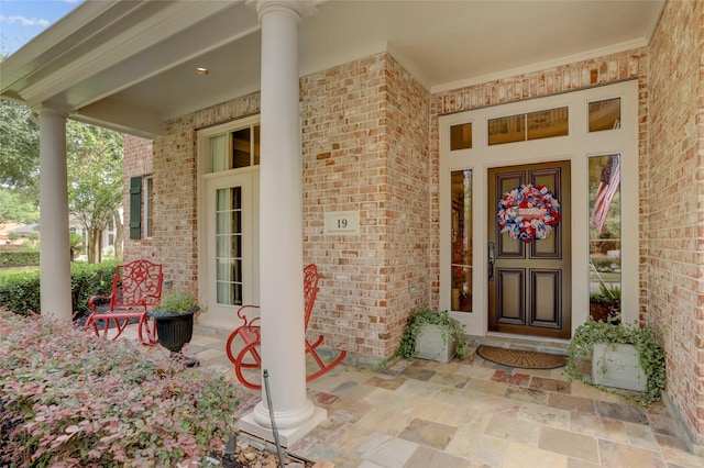 19 Royal Hampton Ct, Sugar Land, TX 77479 - entrance to property featuring brick siding and covered porch