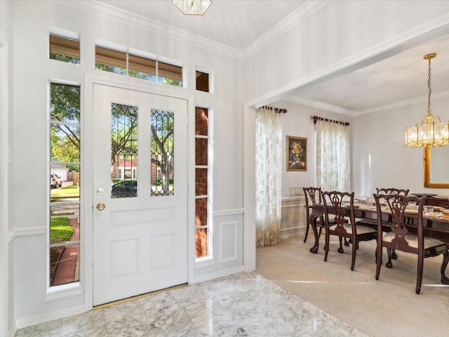4614 Jamaica Dr, Sugar Land, TX 77479 - foyer entrance featuring plenty of natural light, ornamental molding, a chandelier, marble finish floors, and wainscoting