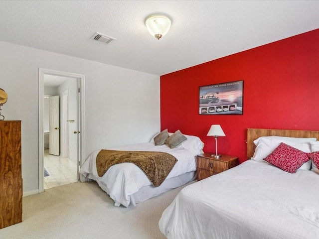 4614 Jamaica Dr, Sugar Land, TX 77479 - bedroom with an accent wall and carpet floors