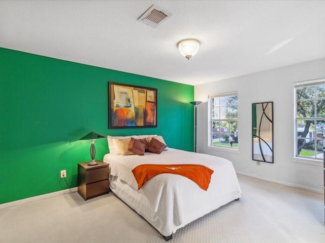 4614 Jamaica Dr, Sugar Land, TX 77479 - bedroom with carpet flooring, baseboards, and an accent wall