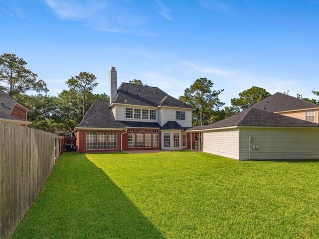 4614 Jamaica Dr, Sugar Land, TX 77479 - back of house featuring a chimney and brick siding
