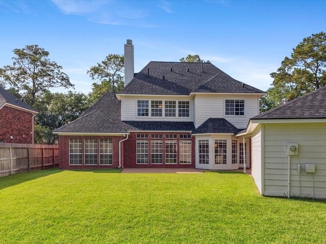 4614 Jamaica Dr, Sugar Land, TX 77479 - back of house with a chimney, roof with shingles, and brick siding