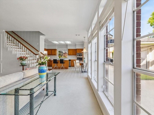 4614 Jamaica Dr, Sugar Land, TX 77479 - living area featuring stairs and light colored carpet