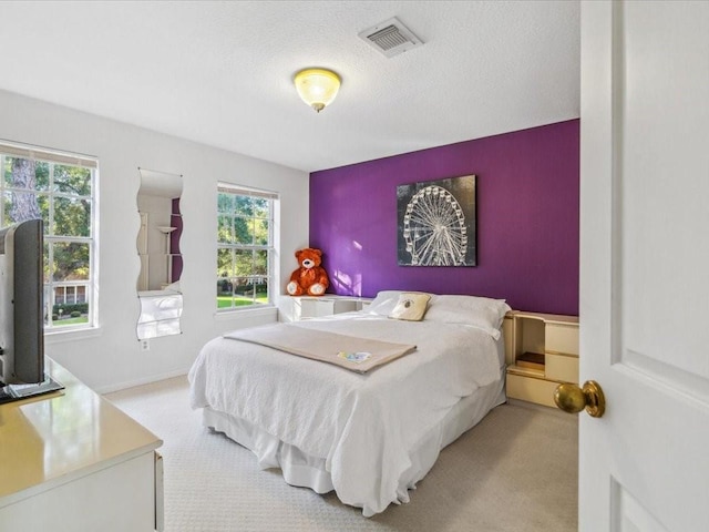 4614 Jamaica Dr, Sugar Land, TX 77479 - bedroom featuring carpet floors and a textured ceiling