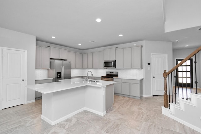 3804 Lancer Cir, Pearland, TX 77581 - kitchen featuring appliances with stainless steel finishes, gray cabinetry, a sink, decorative backsplash, and recessed lighting