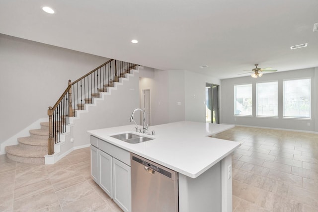 3804 Lancer Cir, Pearland, TX 77581 - kitchen featuring stainless steel dishwasher, a sink, ceiling fan, light countertops, and open floor plan