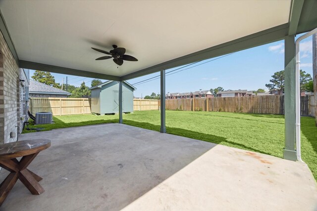 10906 Harvest Sun Dr, Houston, TX 77064 - view of patio / terrace featuring ceiling fan, a shed, an outdoor structure, and central AC
