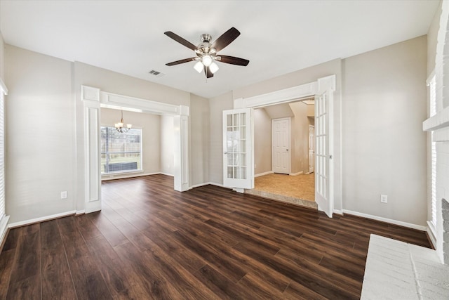 10906 Harvest Sun Dr, Houston, TX 77064 - unfurnished living room featuring a chandelier, dark wood-style flooring, baseboards, and a ceiling fan