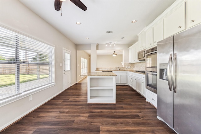 10906 Harvest Sun Dr, Houston, TX 77064 - kitchen featuring appliances with stainless steel finishes, a ceiling fan, open shelves, recessed lighting, and decorative backsplash