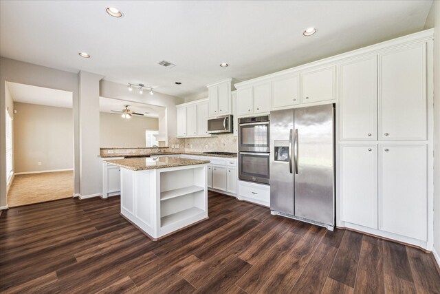 10906 Harvest Sun Dr, Houston, TX 77064 - kitchen featuring stainless steel appliances, open shelves, white cabinetry, dark wood-style flooring, and decorative backsplash