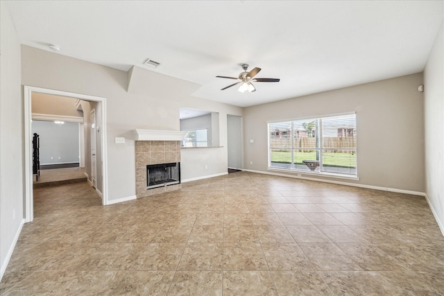 10906 Harvest Sun Dr, Houston, TX 77064 - unfurnished living room featuring ceiling fan, a fireplace, and baseboards