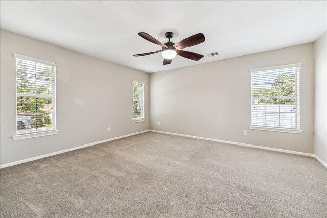 10906 Harvest Sun Dr, Houston, TX 77064 - carpeted empty room with baseboards and a ceiling fan