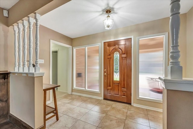18435 Point Lookout Dr, Houston, TX 77058 - foyer entrance featuring baseboards and light tile patterned floors