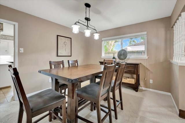 18435 Point Lookout Dr, Houston, TX 77058 - dining area with baseboards and light colored carpet