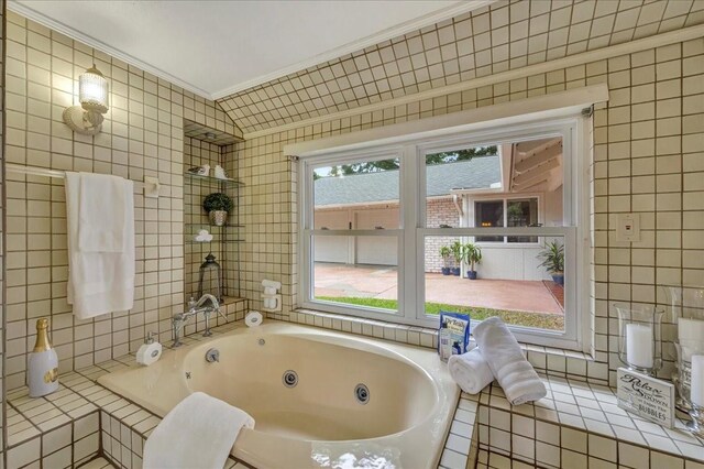 18435 Point Lookout Dr, Houston, TX 77058 - full bathroom with tile walls, a jetted tub, and crown molding