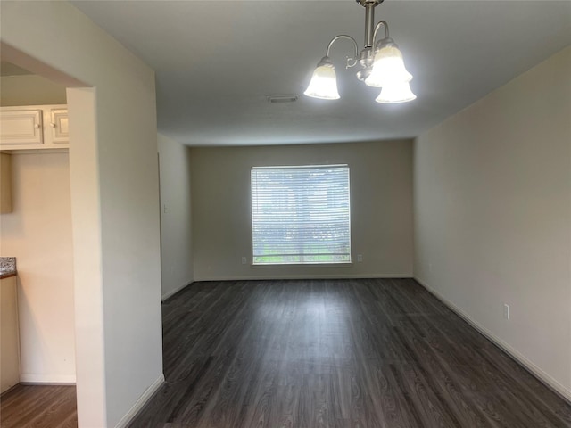 5918 Fergis Dr, Katy, TX 77449 - unfurnished dining area with a chandelier, dark wood-style floors, and baseboards