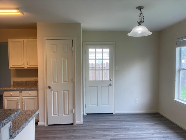 5918 Fergis Dr, Katy, TX 77449 - unfurnished dining area with wood finished floors and baseboards