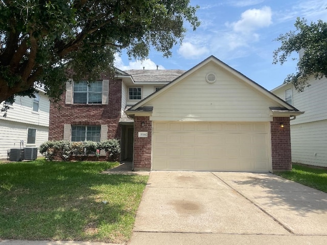 5918 Fergis Dr, Katy, TX 77449 - traditional home featuring brick siding, concrete driveway, a front lawn, an attached garage, and central air condition unit