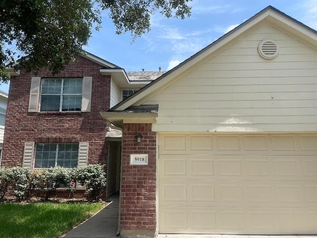 5918 Fergis Dr, Katy, TX 77449 - view of front of home featuring brick siding and an attached garage
