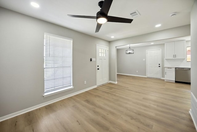 4442 Oak Shadows Dr, Houston, TX 77091 - unfurnished living room featuring ceiling fan, light wood-style flooring, baseboards, and recessed lighting