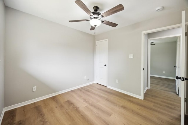 4442 Oak Shadows Dr, Houston, TX 77091 - unfurnished bedroom featuring light wood finished floors, baseboards, and a ceiling fan