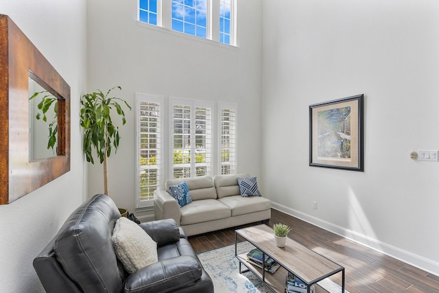 6203 Aspen Pass Dr, Kingwood, TX 77345 - living area featuring a high ceiling, wood finished floors, and baseboards