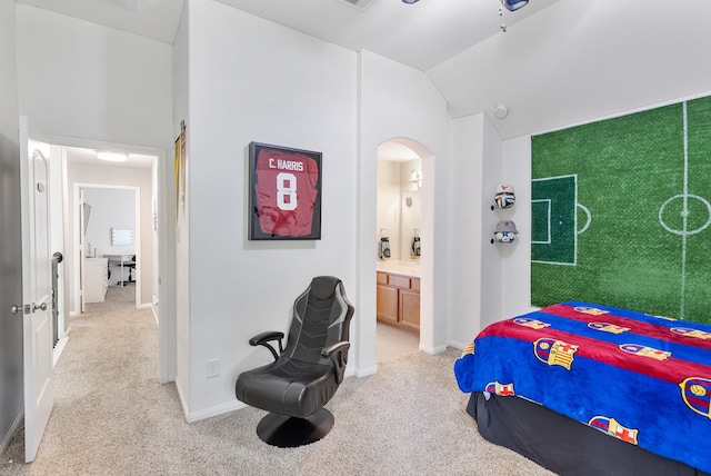 6203 Aspen Pass Dr, Kingwood, TX 77345 - bedroom with light colored carpet, arched walkways, connected bathroom, vaulted ceiling, and baseboards