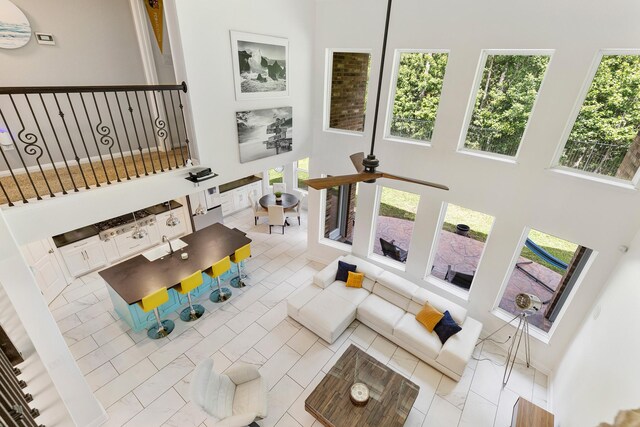 6203 Aspen Pass Dr, Kingwood, TX 77345 - living area with a towering ceiling, plenty of natural light, and ceiling fan